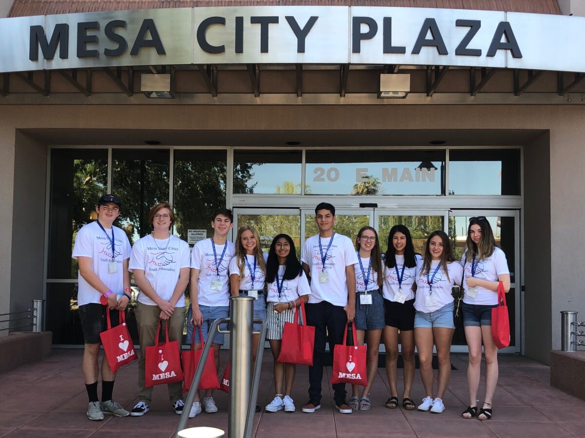 Group of Mesa Sister Cities Youth Ambassadors in front of Mesa City Plaza.